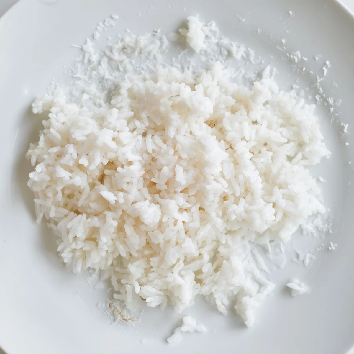 Fluffy Coconut Jasmine Rice, a creamy side dish, ready to be served with delicious curries.