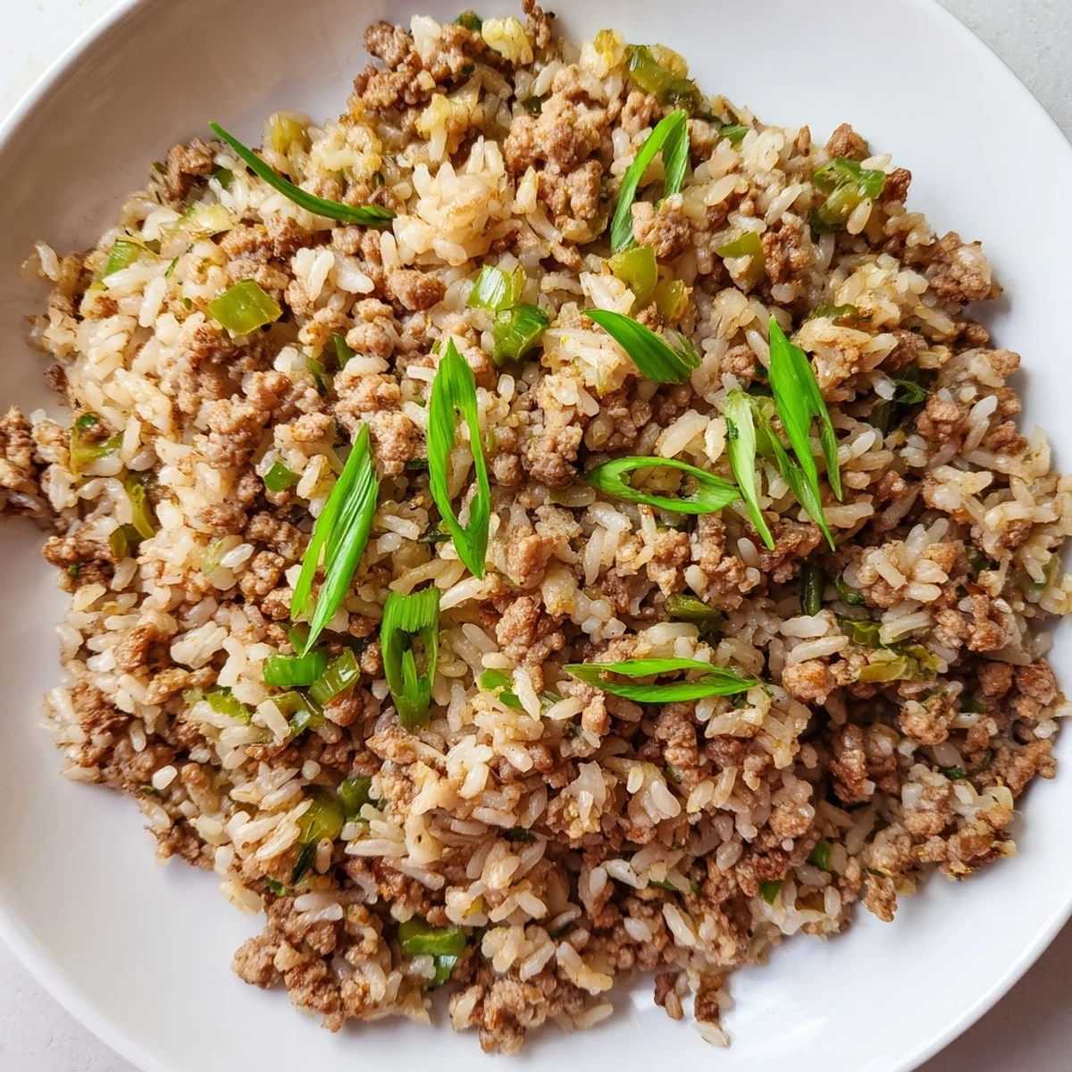 A simmering pot of Cajun Dirty Rice, showcasing the flavorful rice, meat, and vegetable blend beautifully.