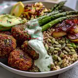 Roasted spring veggies, falafel, and quinoa create this nourishing Spring Buddha Bowl.