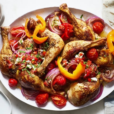 Golden sheet pan Greek chicken with bell peppers, tender and aromatic with vibrant vegetables and feta.