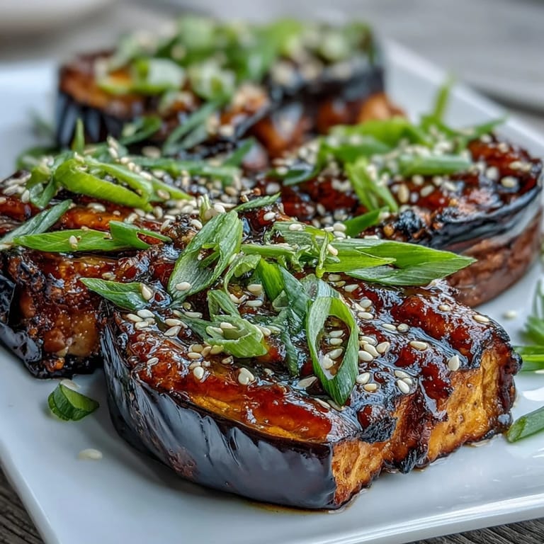 Warm Miso Glazed Eggplant served beside fluffy rice for a savory vegan side.